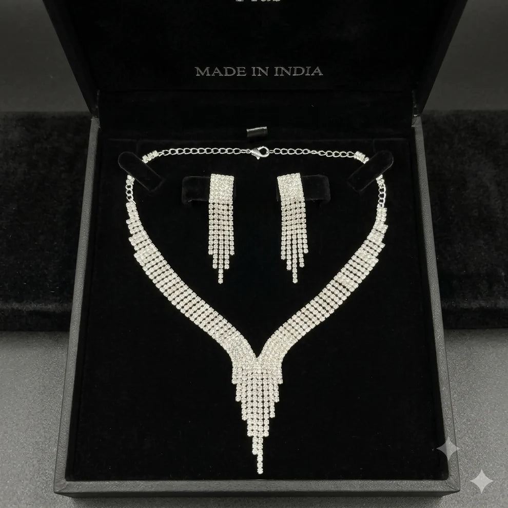 Silver Tone V Shape Necklace and Tassel Earring Set with Sparkling Stones for Party Wear
