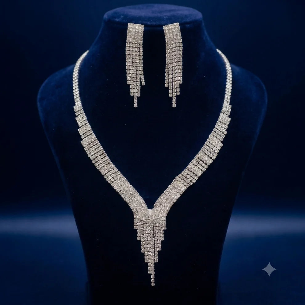 Silver Tone V Shape Necklace and Tassel Earring Set with Sparkling Stones for Party Wear